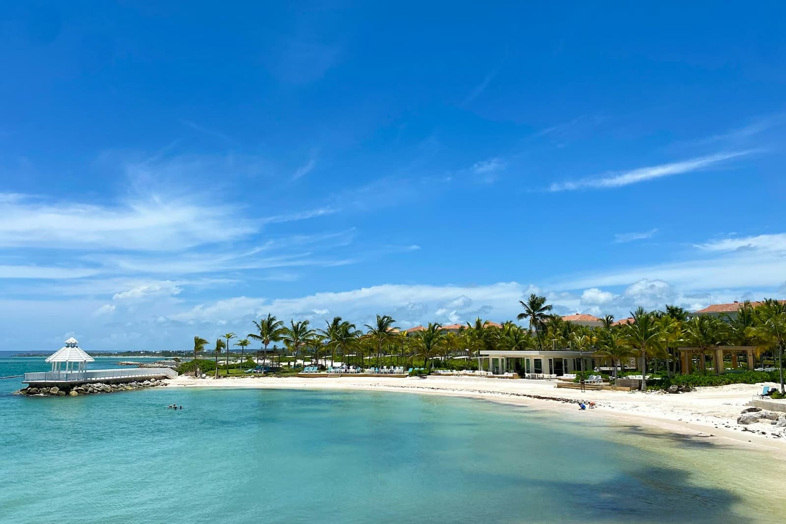 White sand beach with turquoise water and palm trees