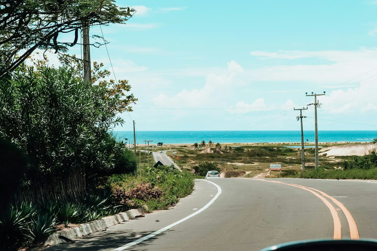 Coastal road seen from inside a car